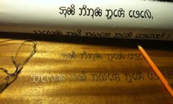 Article One of the Universal Declaration of Human Rights in Chakma. Carving and photo by Tim Brookes Chakma carving in progress