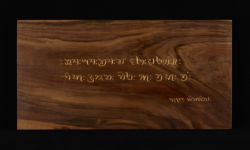 Verse of a hymn in Khojki. Carving by Tim Brookes. Photo by Tom Way Khojki carving