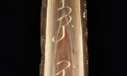 "Mother tongue" in Manchu. Carving by Tim Brookes. Photo by Tom Way. Manchu Carving
