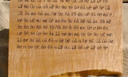 Article One of the Universal Declaration of Human Rights in Pahwah Hmong. Carving and photo by Tim Brookes Pahwah Hmong Carving