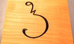 Cherry coaster carved with Sora Sompeng letter P. Carving and photo by Tim Brookes. Sora Sompeng coaster