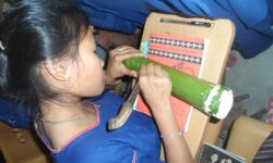 Student practicing Hanunuo. Photo courtesy of the Mangyan Heritage Center Student practicing Hanunuo