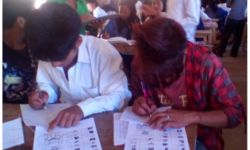 Students Taking an Examination in the Wancho Script Students Taking an Examination