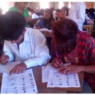 Students Taking an Examination in the Wancho Script Students Taking an Examination
