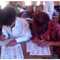 Students Taking an Examination in the Wancho Script Students Taking an Examination