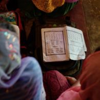 Students reading Rohingya (written Hanifi script) from books in Kutupalong Refugee Camp near Cox's Bazar, Bangladesh. Photo: Eric DeLuca, Translators without Borders Hanifi