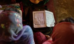 Students reading Rohingya (written Hanifi script) from books in Kutupalong Refugee Camp near Cox's Bazar, Bangladesh. Photo: Eric DeLuca, Translators without Borders Hanifi