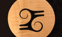 Kwatakye Atiko, a symbol that is said to imitate the hairstyle of Kwatakye, a warrior hero. As such, it stands for bravery or courage. Carving and photo by Tim Brookes. Kwatakye Atiko